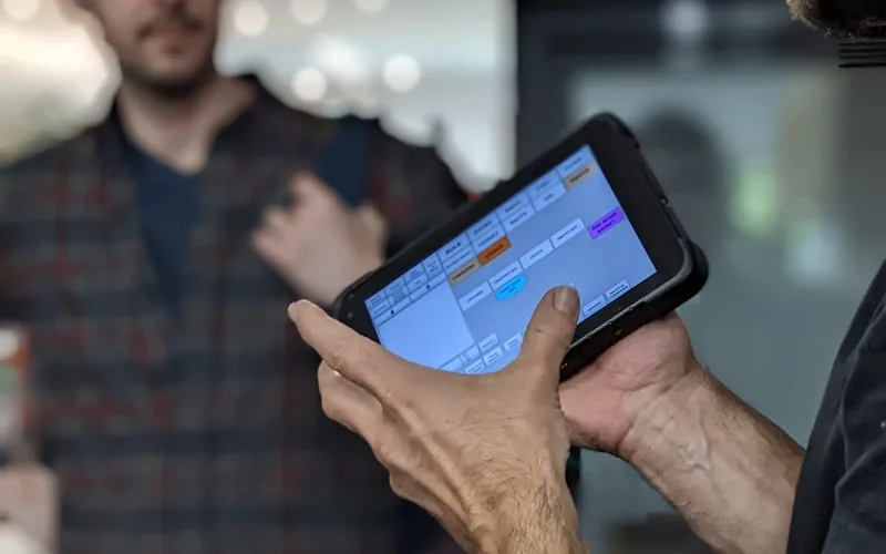 Field team using a rugged tablet for logistics operations